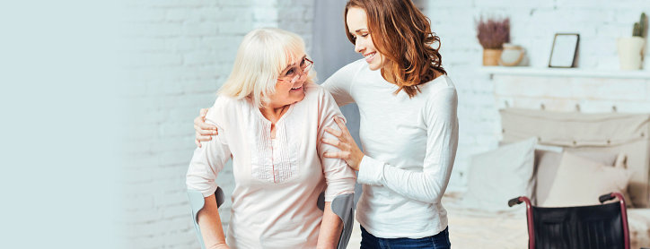 adult woman together with her caregiver
