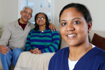 health care worker and an elderly couple